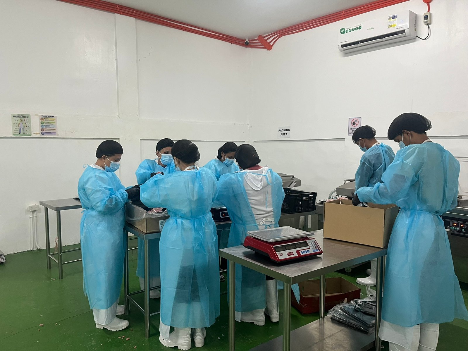 NE Meats staff packing and weighing meat orders